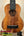 Exquisite KoAloha KSM-00 Soprano Ukulele with dark grain and black fretboard on stand
