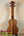 Wooden ukulele with grain and black pegs, featuring the Exquisite KoAloha KSM-00 Soprano Ukulele