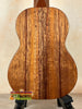 Wooden acoustic guitar showcasing unique grain, ideal for the Exquisite KoAloha KSM-00