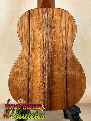 Wooden acoustic guitar showcasing unique grain, ideal for the Exquisite KoAloha KSM-00