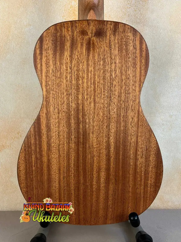 Wooden acoustic guitar with mahogany grain in Flight Acoustic-Electric Baritone Uke Soundwave