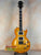 Honey-colored Les Paul style guitar features dual humbuckers, ideal for Centurion VB Tenor