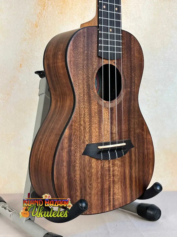 Wooden Flight Juliana Acacia Concert Ukulele with dark brown grain and black tuning pegs