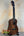 Wooden Flight Juliana Acacia Concert Ukulele with dark grains and black strings