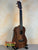 Wooden Flight Juliana Acacia Concert Ukulele with dark grains and black strings