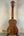 Wooden ukulele with natural finish and black tuning pegs, Flight Juliana Acacia Concert
