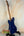 Navy blue electric guitar on black stand for Flight Pathfinder Tenor Electric Ukulele