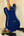 Glossy blue electric guitar on black stand, Flight Pathfinder Tenor Electric Ukulele