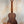 Classical acoustic guitar with dark walnut finish in Flight Victoria Tenor EQ-A Uke