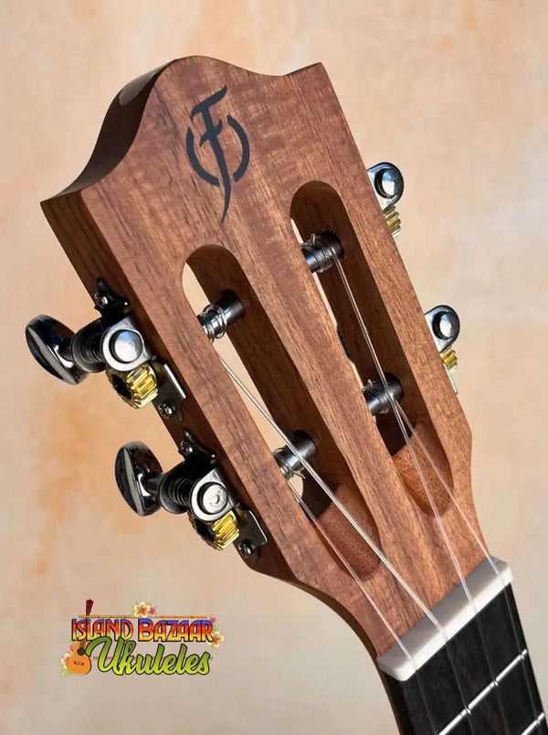 Wooden guitar headstock with tuning pegs on Flight Victoria Tenor EQ-A Ukulele