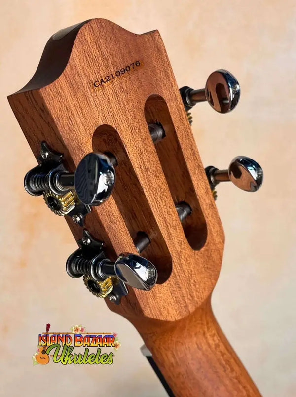 Wooden guitar headstock with black tuning pegs on Flight Victoria Tenor EQ-A Uke