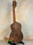 Wooden Flight Victoria Tenor EQ-A ukulele showcasing wood grain and dark binding