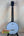 Gold Tone Concert-Scale Banjolele with a white head and black tuning pegs and hardshell case