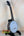 Gold Tone Concert-Scale Banjolele with Hardshell Case on black stand showcasing plate-style resonator
