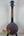 Five-string banjo with dark wood body, part of Gold Tone Concert-Scale Banjolele