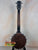 Dark wooden Gold Tone Tenor-Scale Banjolele with metal hardware and tuning pegs