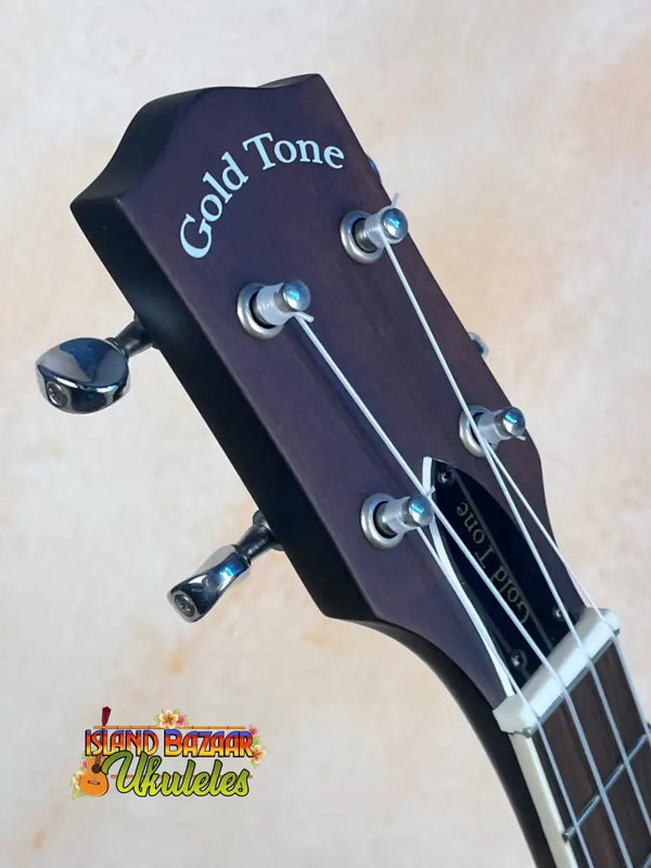 Guitar headstock with Gold Tone branding for tenor-scale banjolele and tuning pegs