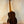 Wooden baritone ukulele with dark rosewood back, showcasing Ohana TK-50G design