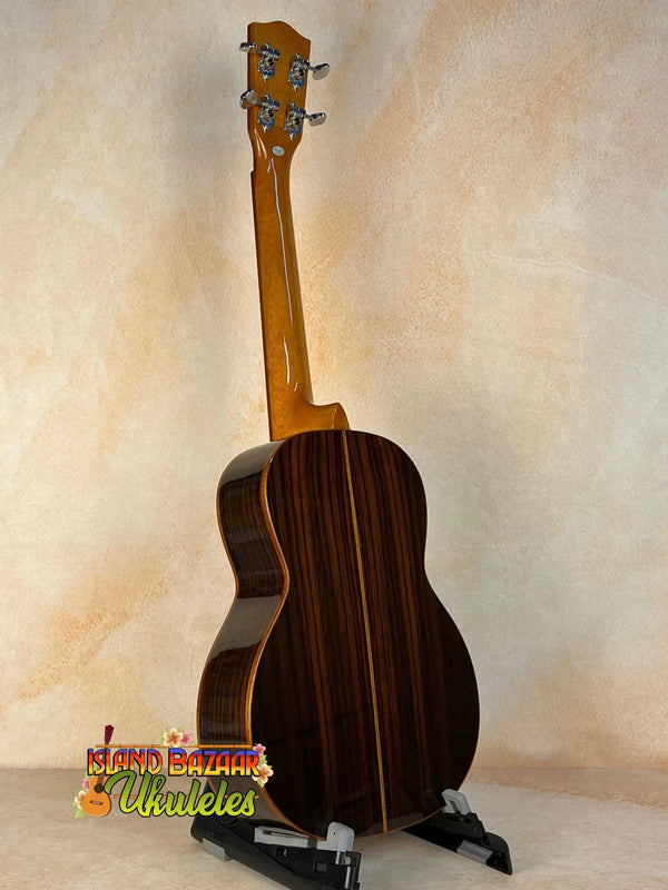 Wooden baritone ukulele with dark rosewood back, showcasing Ohana TK-50G design