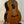 Wooden Ohana TK-50G Solid Cedar & Rosewood Tenor Ukulele on a black stand