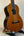 Wooden Ohana TK-50G Solid Cedar & Rosewood Tenor Ukulele on a black stand