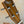 Wooden Ohana TK-50G ukulele headstock with chrome tuning pegs and rosewood finish