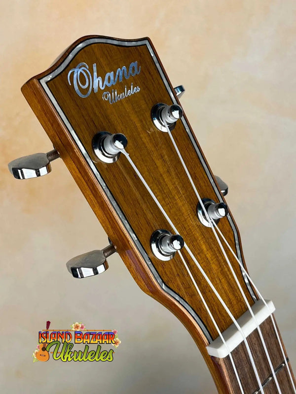 Wooden Ohana TK-50G ukulele headstock with chrome tuning pegs and rosewood finish