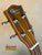 Wooden Ohana TK-50G ukulele headstock with chrome tuning pegs and rosewood finish