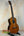 Wooden Ohana TK-50G Solid Cedar & Rosewood Tenor Ukulele on a black stand