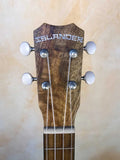 Wooden headstock of Kanile’a MT-4 Mahogany Tenor Ukulele with Lanikai branding.