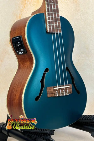 Teal blue Kala Archtop Tenor Ukulele with wooden sides and classic archtop design