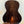 Kala Bocote Tenor Ukulele with dark striped wood grain back panel on display stand