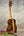Kala Contour Series Tenor Ukulele with solid acacia wood and striped back on stand