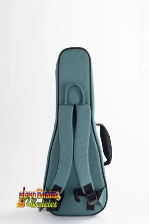 Teal padded Kala Deluxe Concert Ukulele Case with black backpack straps for easy transport