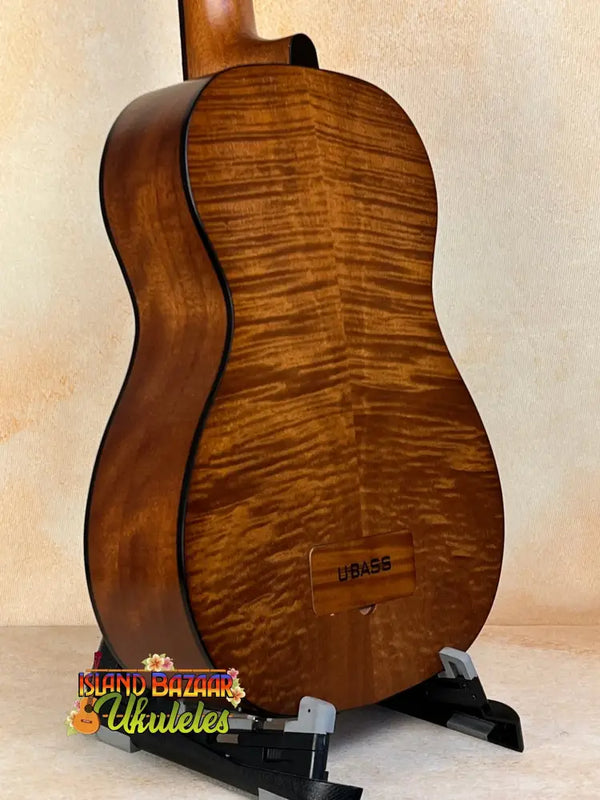 Acoustic guitar with figured maple back, showcasing Kala EM-FS Exotic Macawood Tenor