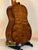 Acoustic guitar with figured maple back, showcasing Kala EM-FS Exotic Macawood Tenor