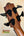 Bass guitar headstock with black tuning pegs on Kala EM-FS Exotic Macawood Tenor Ukulele