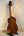 Wooden bass ukulele with figured maple back from Kala EM-FS Exotic Macawood Tenor Ukulele