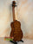 Wooden bass ukulele with figured maple back from Kala EM-FS Exotic Macawood Tenor Ukulele