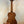 Wooden acoustic guitar with rich brown finish showcasing Kala EM-FS Exotic Macawood Tenor