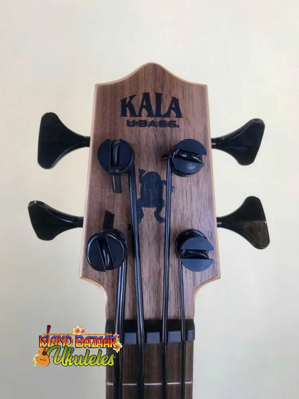 Kala EM-FS U-Bass headstock with black tuning pegs, featuring exotic mahogany acoustic-electric design