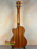 Wooden acoustic guitar back and neck showcasing Kala Gloss Spruce Cutaway Tenor Ukulele