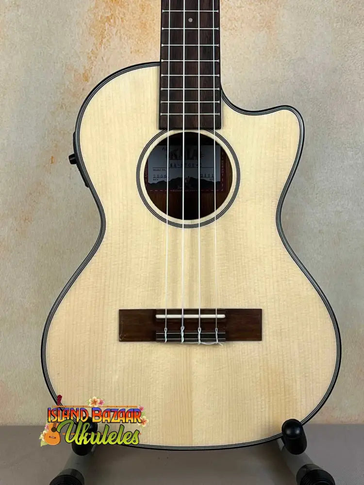 Light-colored Kala Gloss Spruce Cutaway Tenor Ukulele showcasing higher frets design