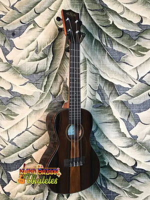 Dark wooden Kala Ziricote Ukulele with four strings from the Gloss Ziricote Series