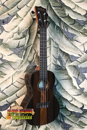 Dark wooden Kala Ziricote Ukulele with four strings from the Gloss Ziricote Series