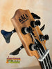 Wooden Kala bass guitar headstock with black tuning pegs from Kala Journeyman U•BASS®