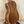 Wooden acoustic guitar with light binding on display for Kala Journeyman U•BASS®