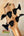 Bass guitar headstock with black tuning pegs on Kala Journeyman U•BASS® wooden neck