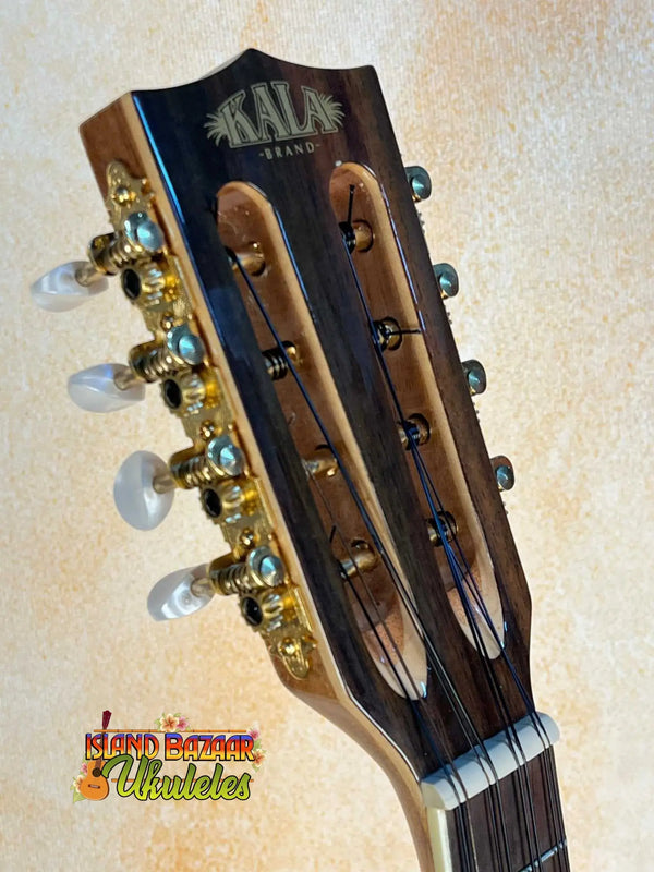 Guitar headstock with gold tuning pegs on Kala KA-8 Eight-String Tenor Ukulele