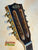 Guitar headstock with gold tuning pegs on Kala KA-8 Eight-String Tenor Ukulele